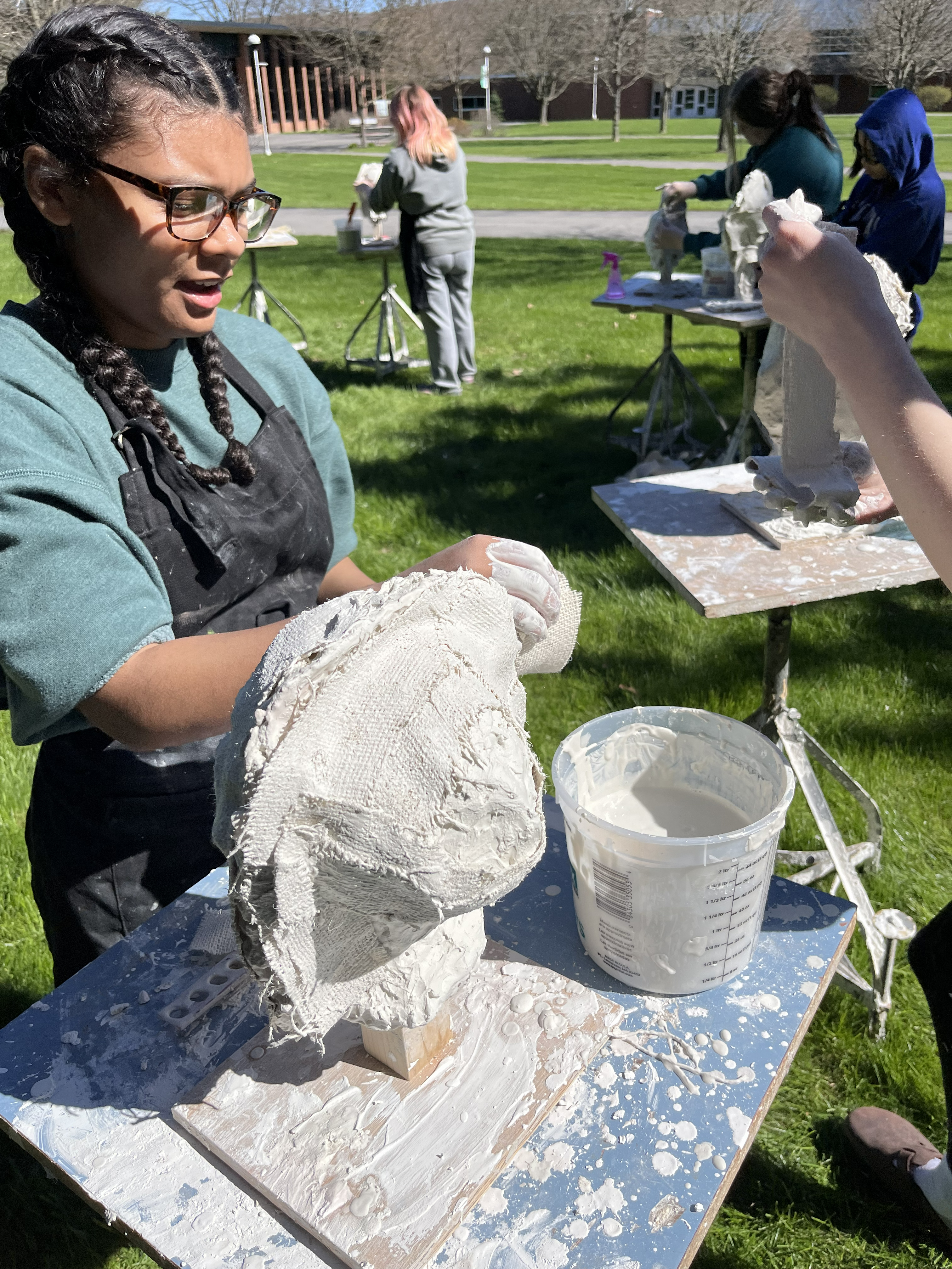 Sculpture students working outdoors