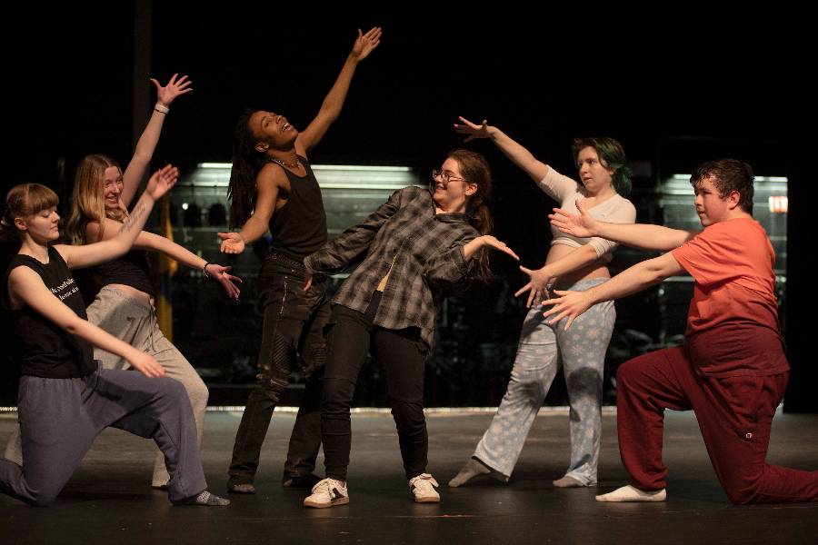 theater students in rehearsal on stage