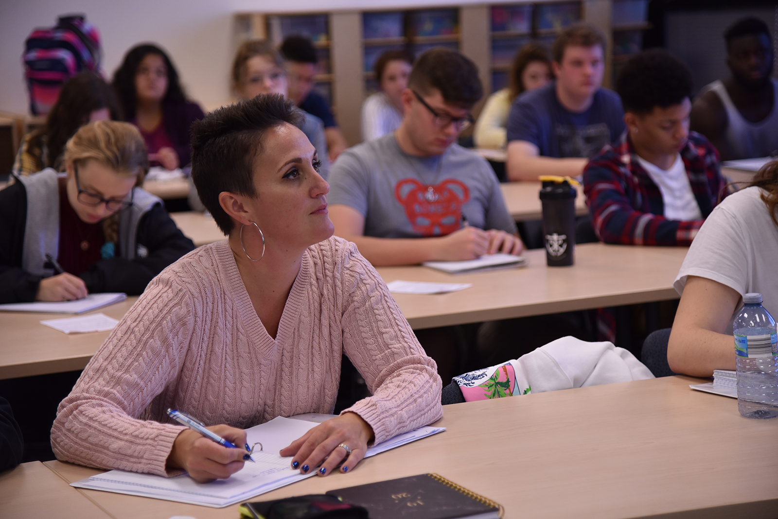 Students of all ages sitting in class lecture