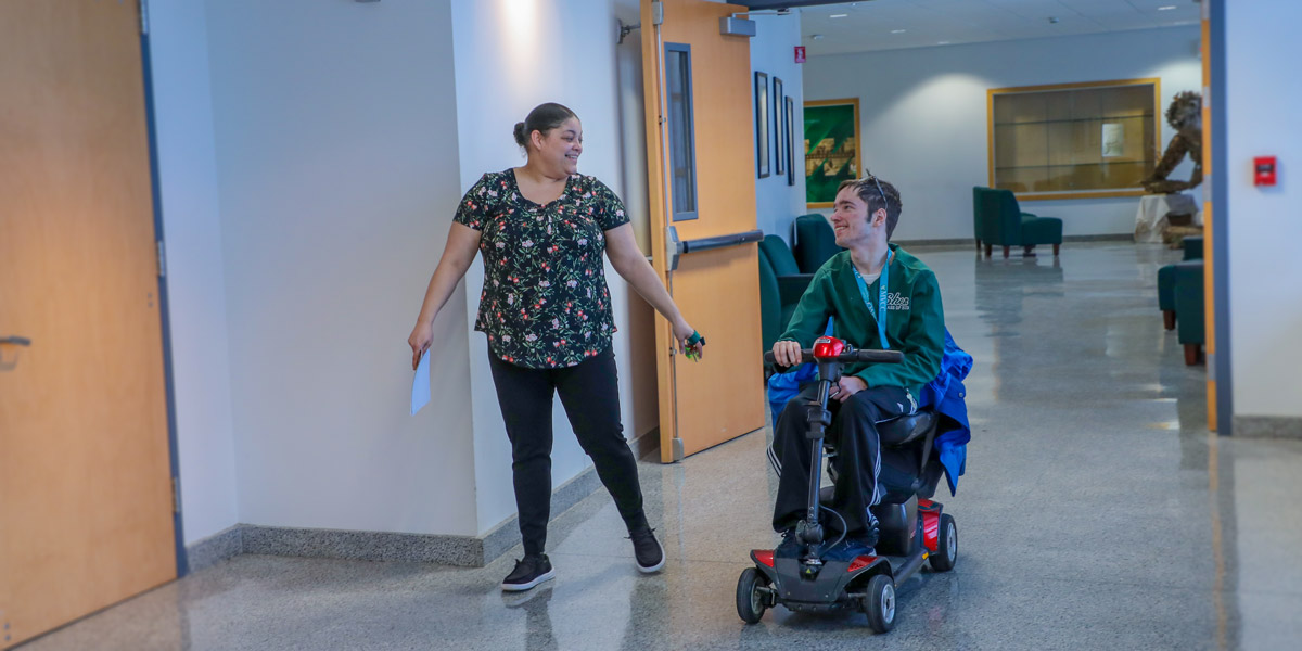Image of OAR staff working with student with disabilities