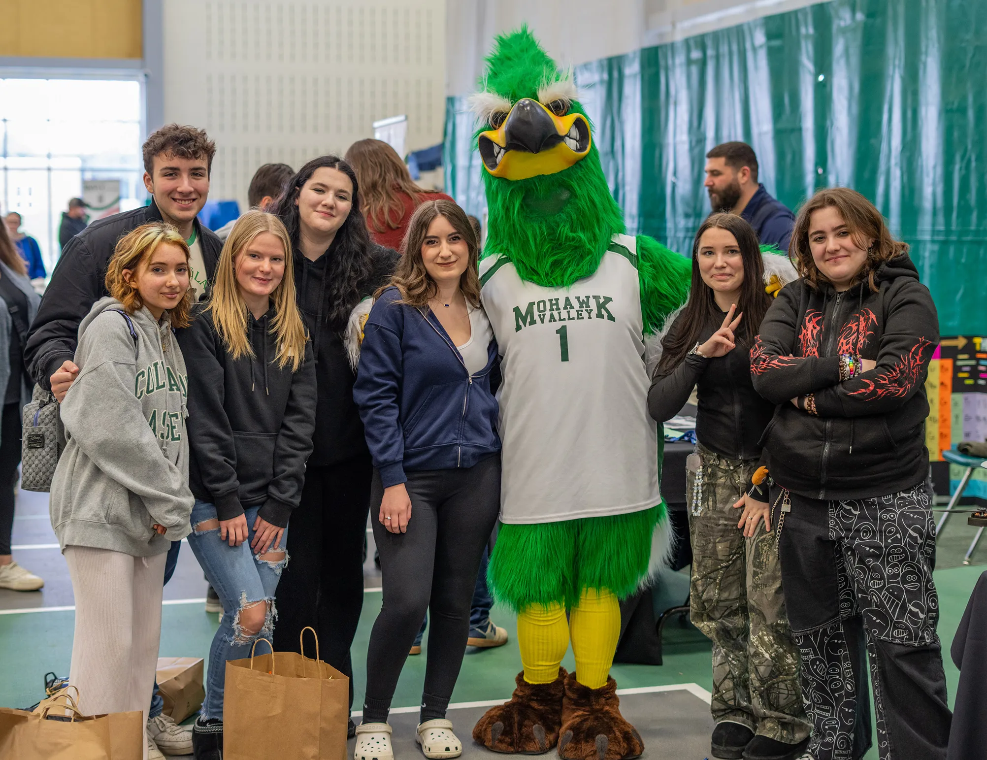 Students standing with MVCC mascot Mo Hawk at Open House