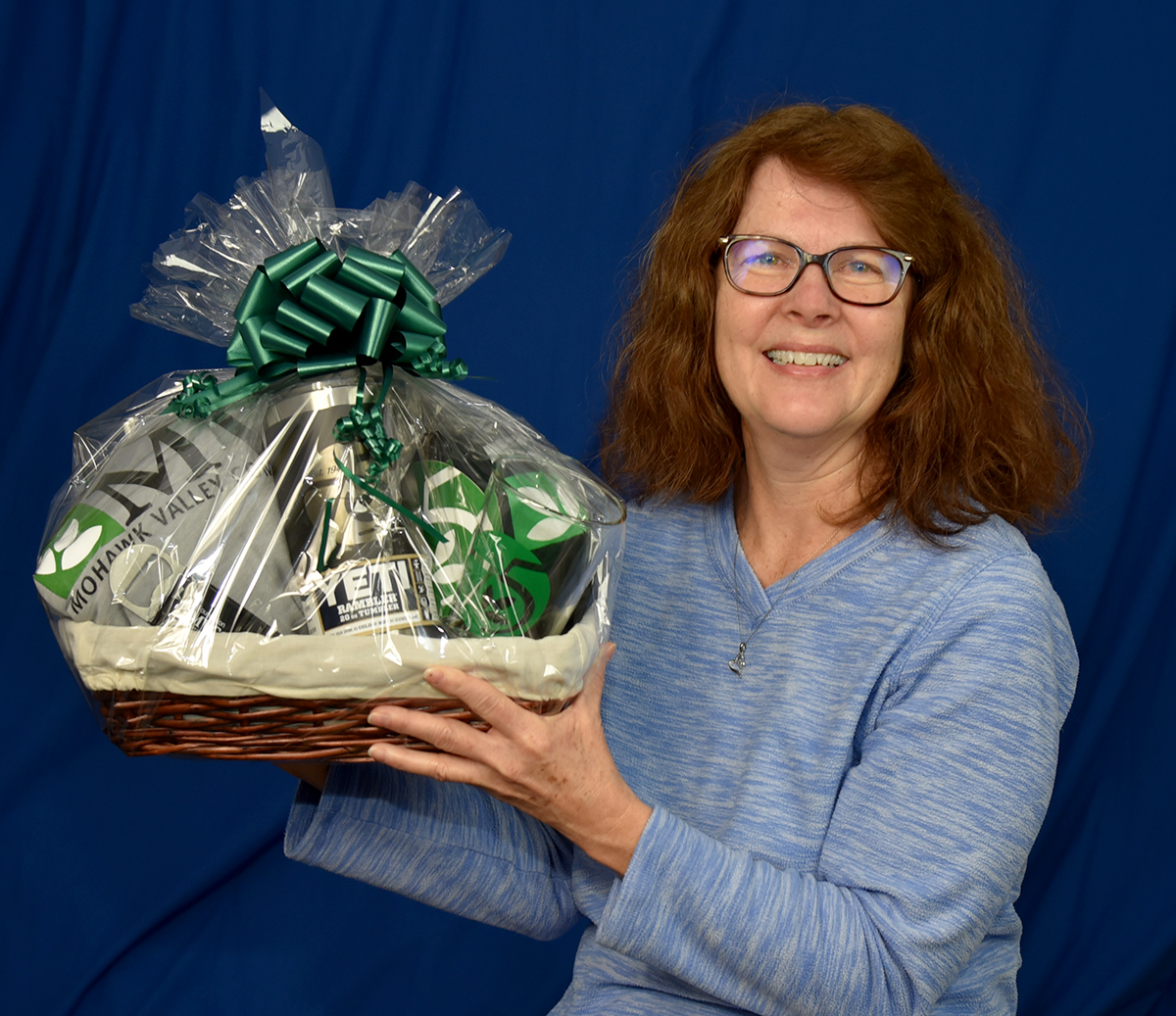 Sharon Kaelin holding MVCC gift basket