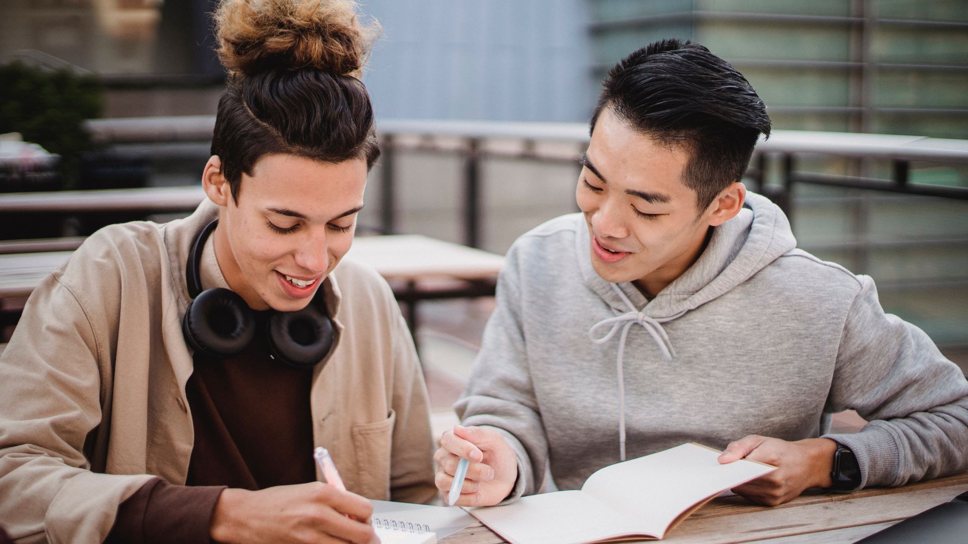 two students working on writing