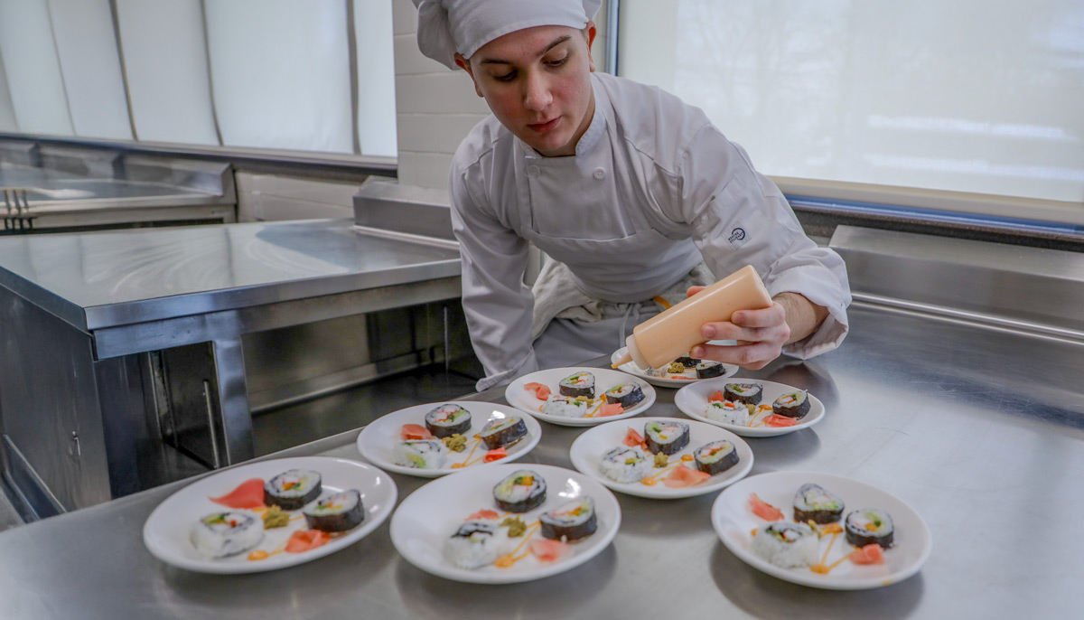Picture of MVCC student making Sushi Dishes