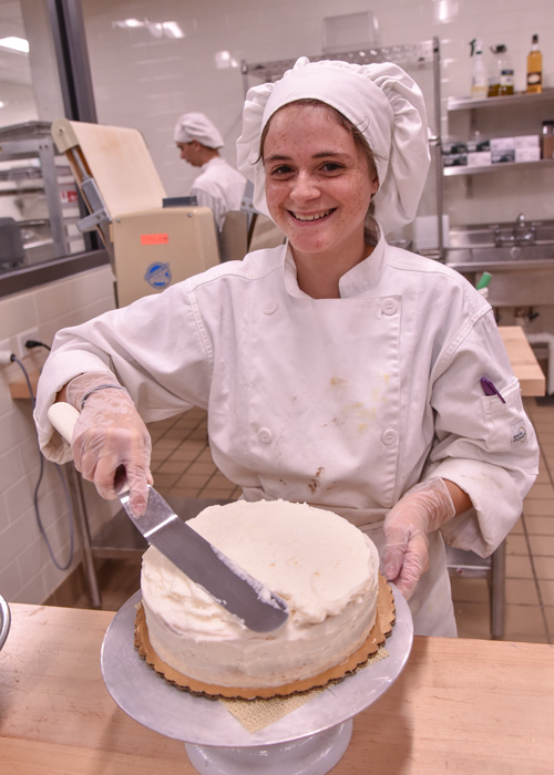 student baking a cake