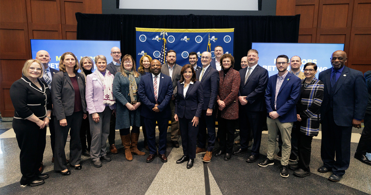 Image of people standing with NY Governor Kathy Hochul