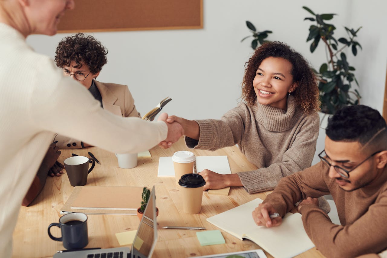 image of people sitting at a table with coffee