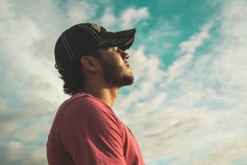man breathing deeply relaxed